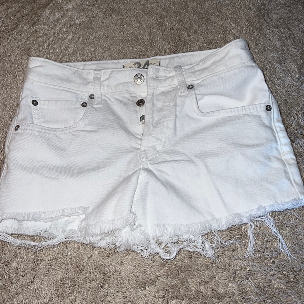 I’m selling high wasted distressed white jean shorts
